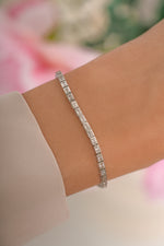 Silver Bezeled Baguette Tennis Bracelet by Sami Jewels featuring a sleek, elegant design with baguette-cut stones.
