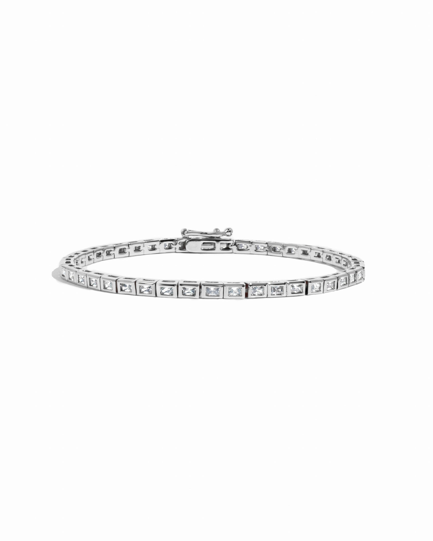 Silver Bezeled Baguette Tennis Bracelet by Sami Jewels with a row of sparkling baguette-cut stones on a white background.