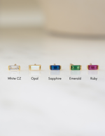 baguette stud earrings labeled 'White CZ', 'Opal', 'Sapphire', 'Emerald', and 'Ruby' on a white background.
