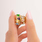 Model holding dainty 14k gold plated baguette birthstone rings from Sami Jewels