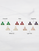birthstone tiny stud earrings in gold showcasing different color variants such as emerald, ruby, sapphire, white cz and light pink