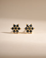 Gold-front view of Sami Jewels black flower stud earrings featuring intricate floral design in black.