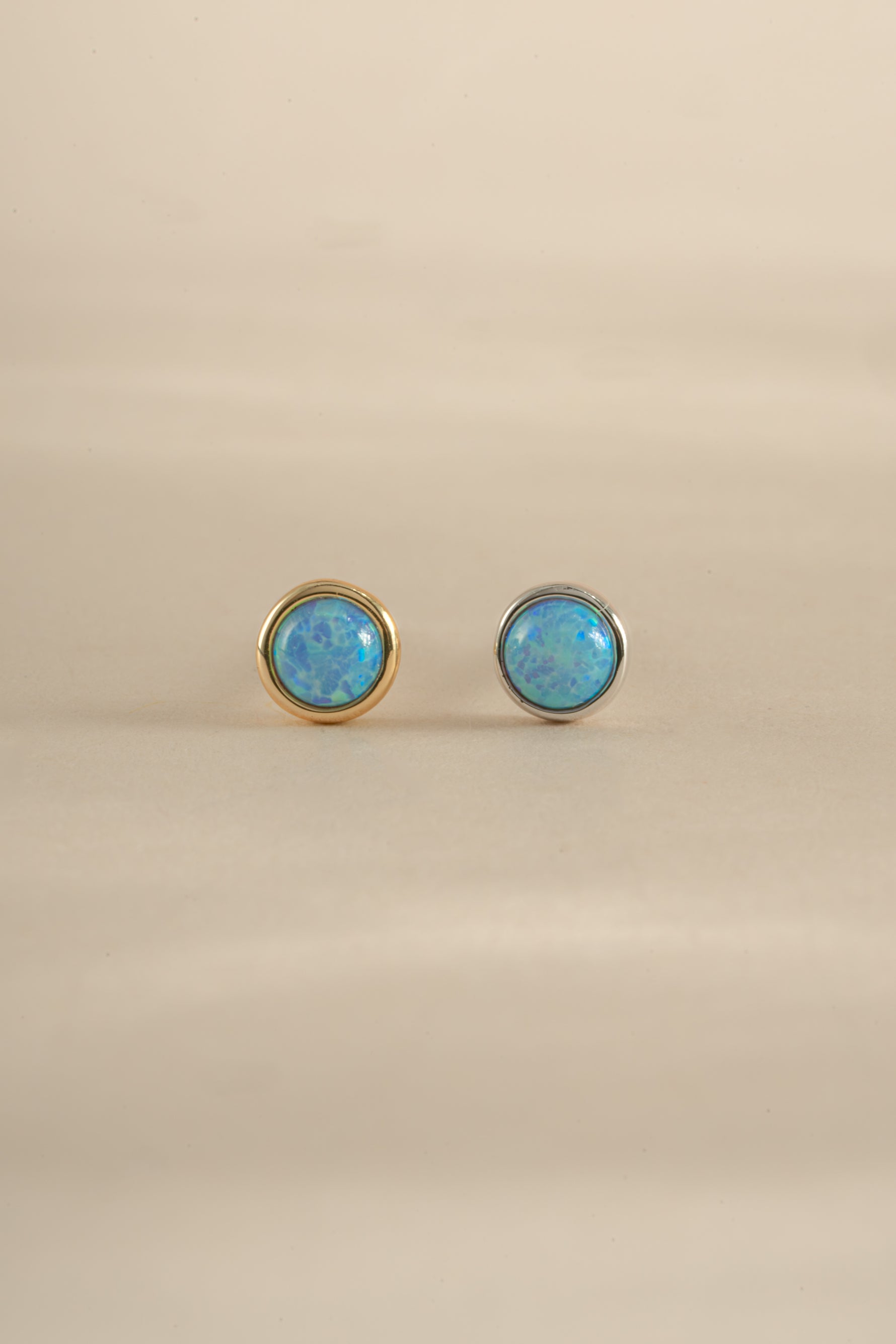 Blue opal stud earrings by Sami Jewels featuring gold and sterling silver settings.