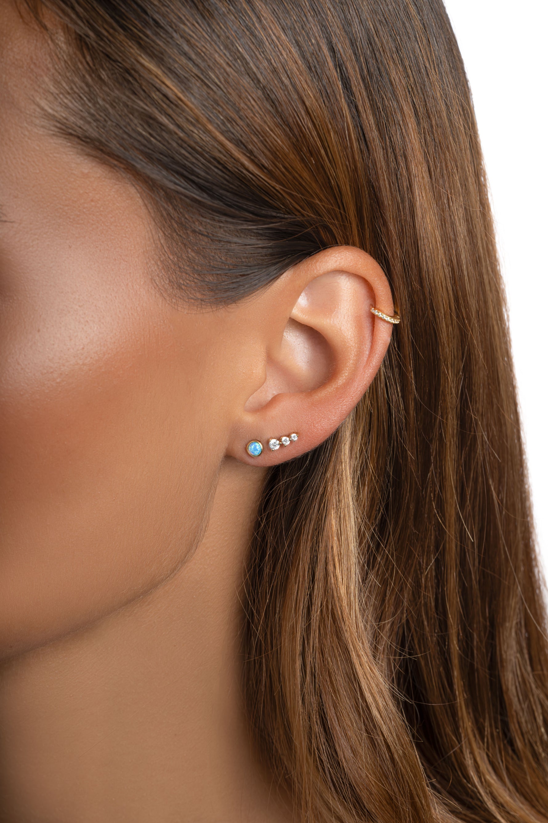 Blue Opal Stud Earrings by Sami Jewels featuring gold settings with polished blue opal stones.