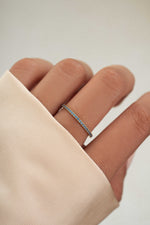 gold blue topaz December birthstone ring on models hand 