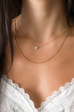 Gold box chain necklace from Sami Jewels styled on a model, showcasing its sleek, modern design.