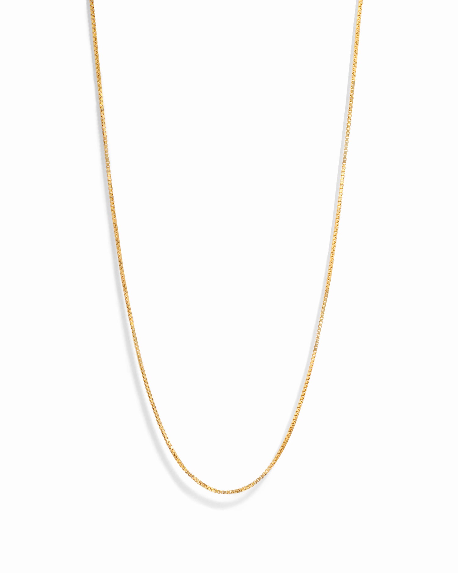 Gold box chain necklace from Sami Jewels displayed on a white background, showcasing its sleek and elegant design.