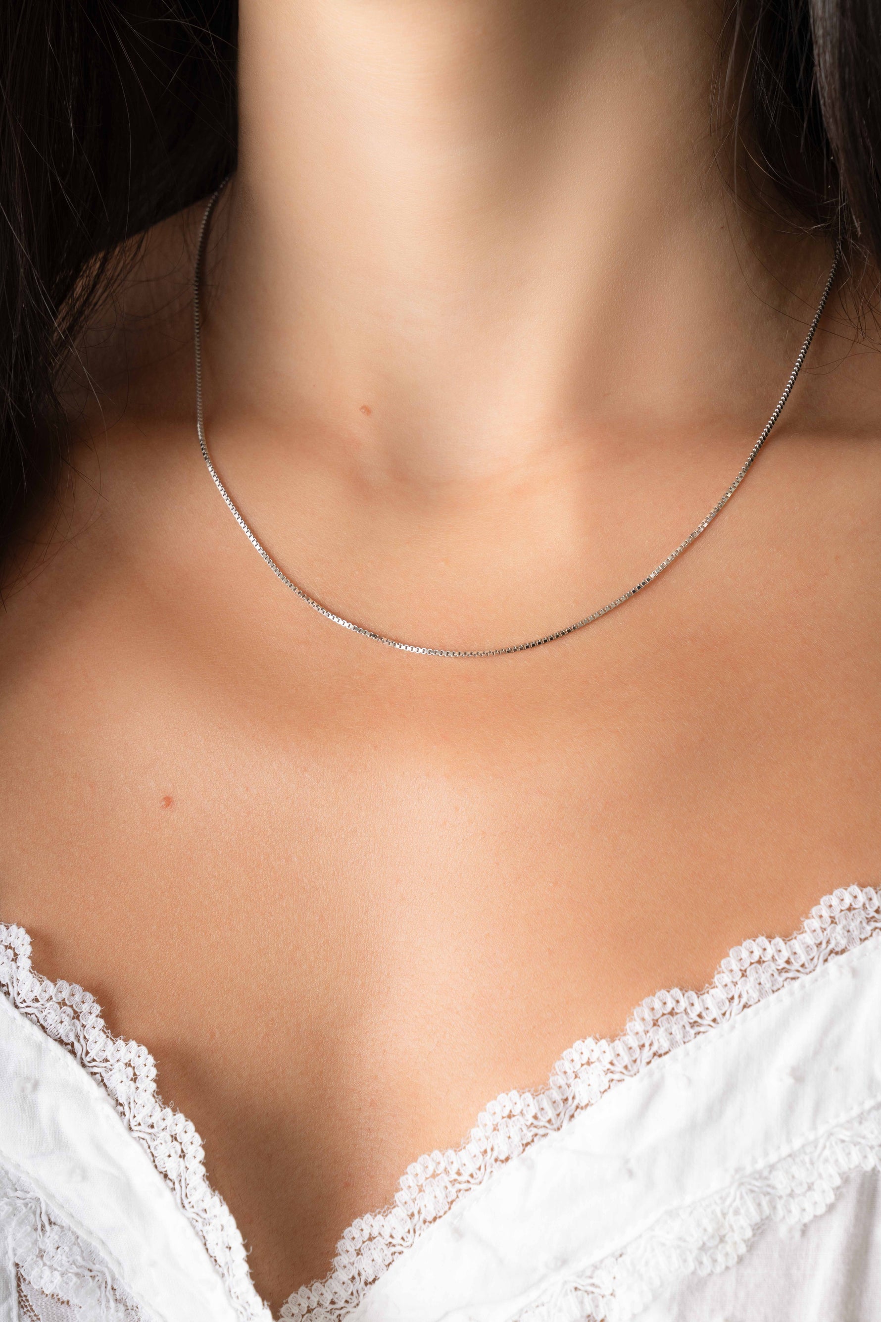 Sterling silver Box Chain Necklace by Sami Jewels, featuring a sleek, square-link design worn on a model.