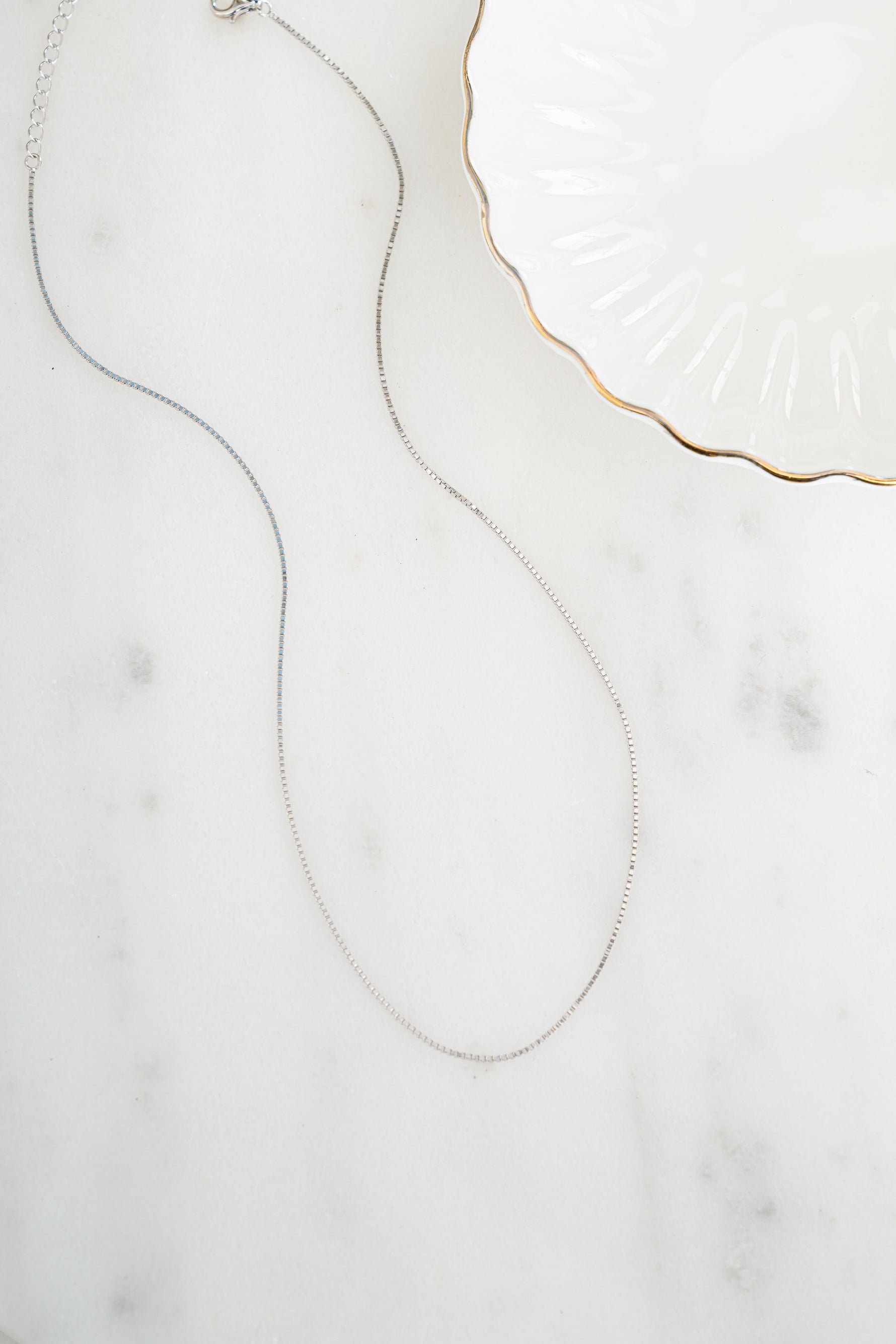 Sterling silver Box Chain Necklace by Sami Jewels showcasing a sleek, polished box chain design on a plain background.