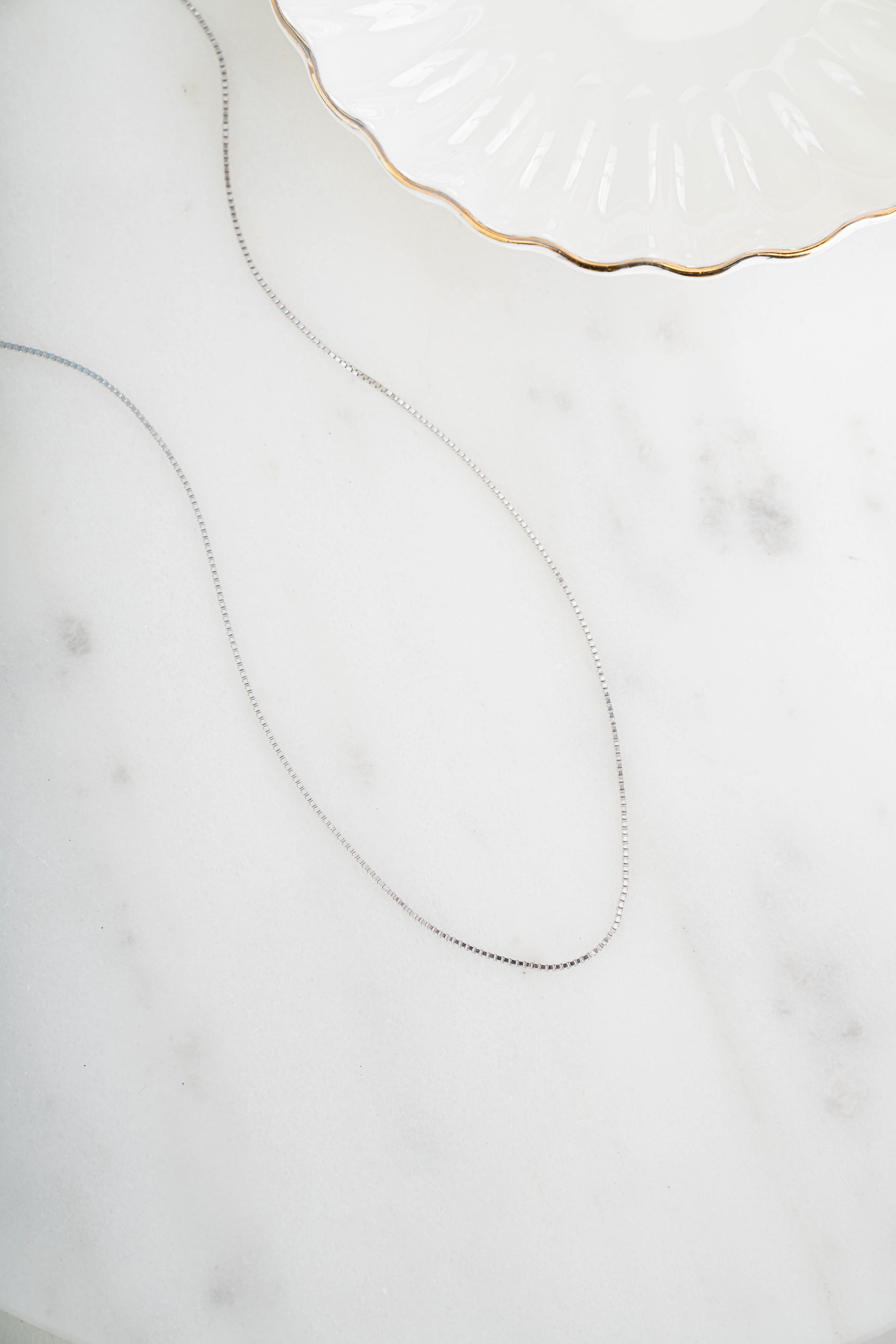 Sterling silver box chain necklace from Sami Jewels, featuring a sleek and modern design with a smooth, polished finish.