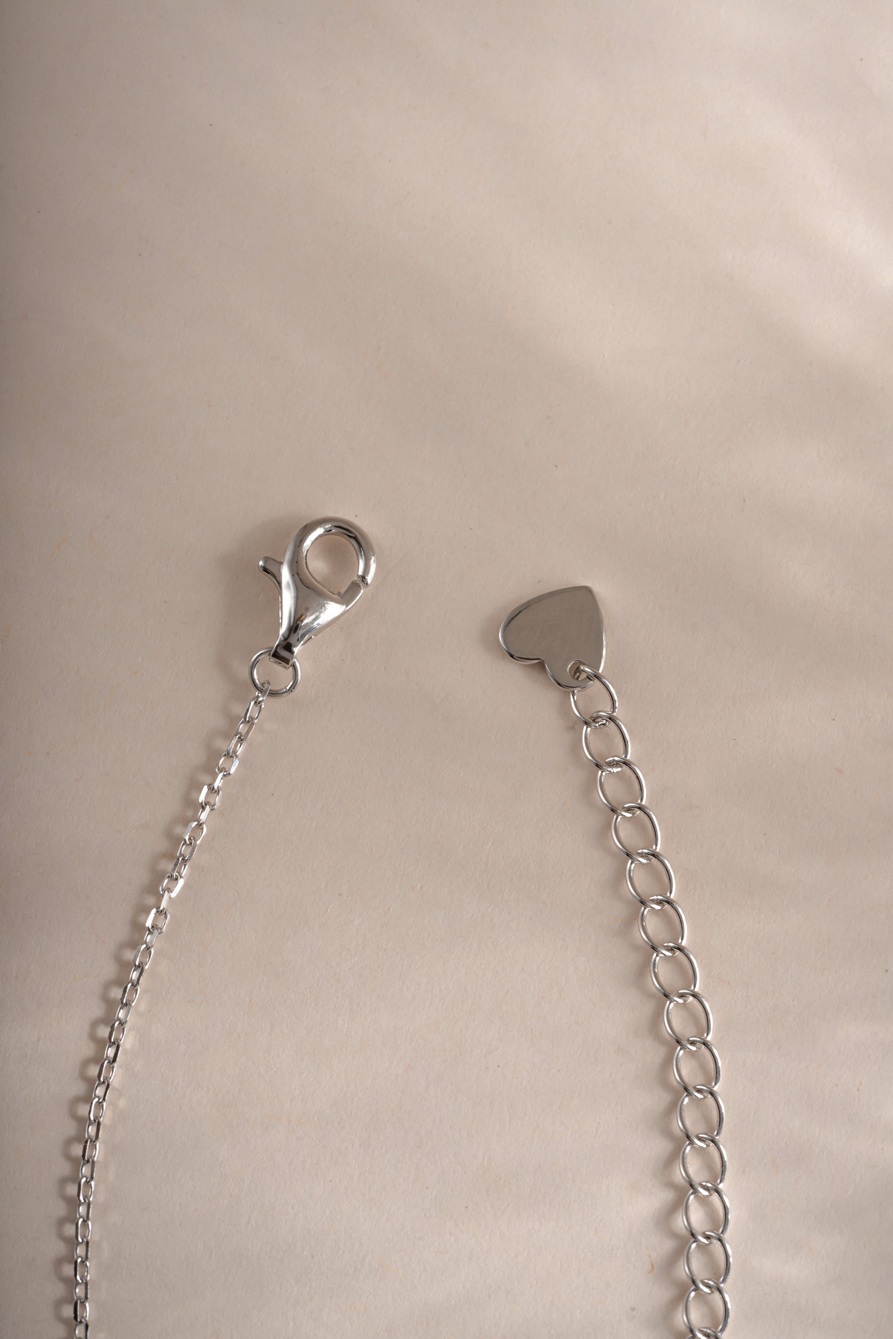 Sterling silver butterfly necklace by Sami Jewels with lobster clasp closure, detailed butterfly pendant on a delicate chain.