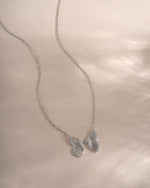 Sterling silver butterfly necklace from Sami Jewels with detailed butterfly pendant on a delicate chain.