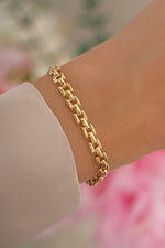 Gold Jasmine Link Bracelet by Sami Jewels featuring a delicate chain-link design on a model.