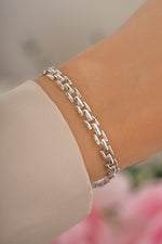 Sterling silver Jasmine Link Bracelet from Sami Jewels featuring elegant chain-link design on a model.