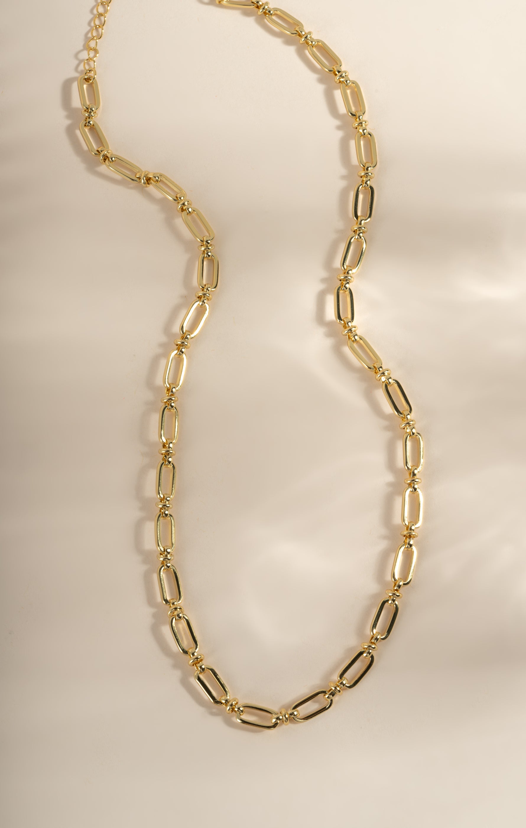 Gold chain link necklace from Sami Jewels, showcasing a stylish and elegant design with interlocking links.