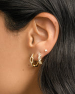 Small chain link hoop earrings by Sami Jewels worn on a model, showcasing a stylish, minimalist jewelry accessory.