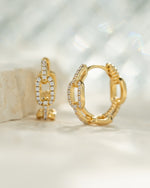 Gold small chain link hoop earrings by Sami Jewels, close-up of intricate chain-link design on round earrings.