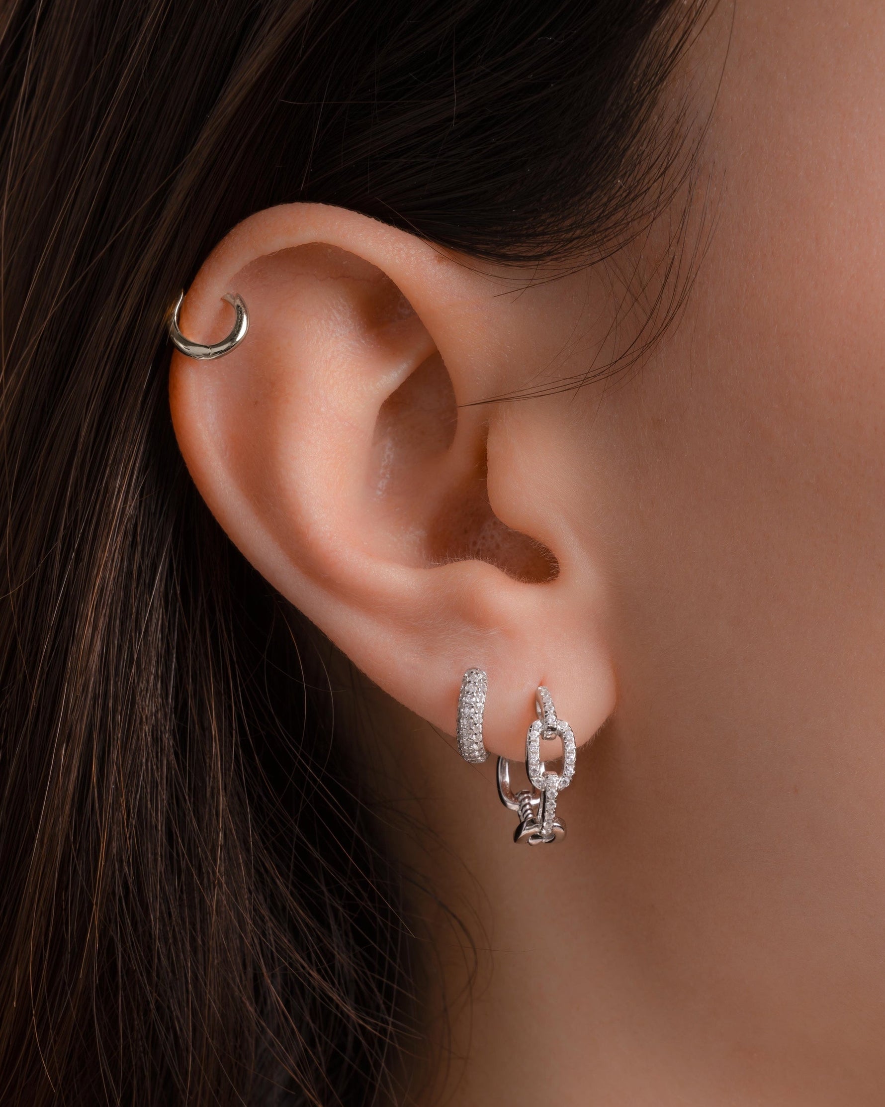 Sterling silver small chain link hoop earrings by Sami Jewels, featuring a delicate, interconnected chain design.