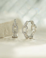 Sterling silver small chain link hoop earrings by Sami Jewels, showcasing a delicate, interconnected link design.