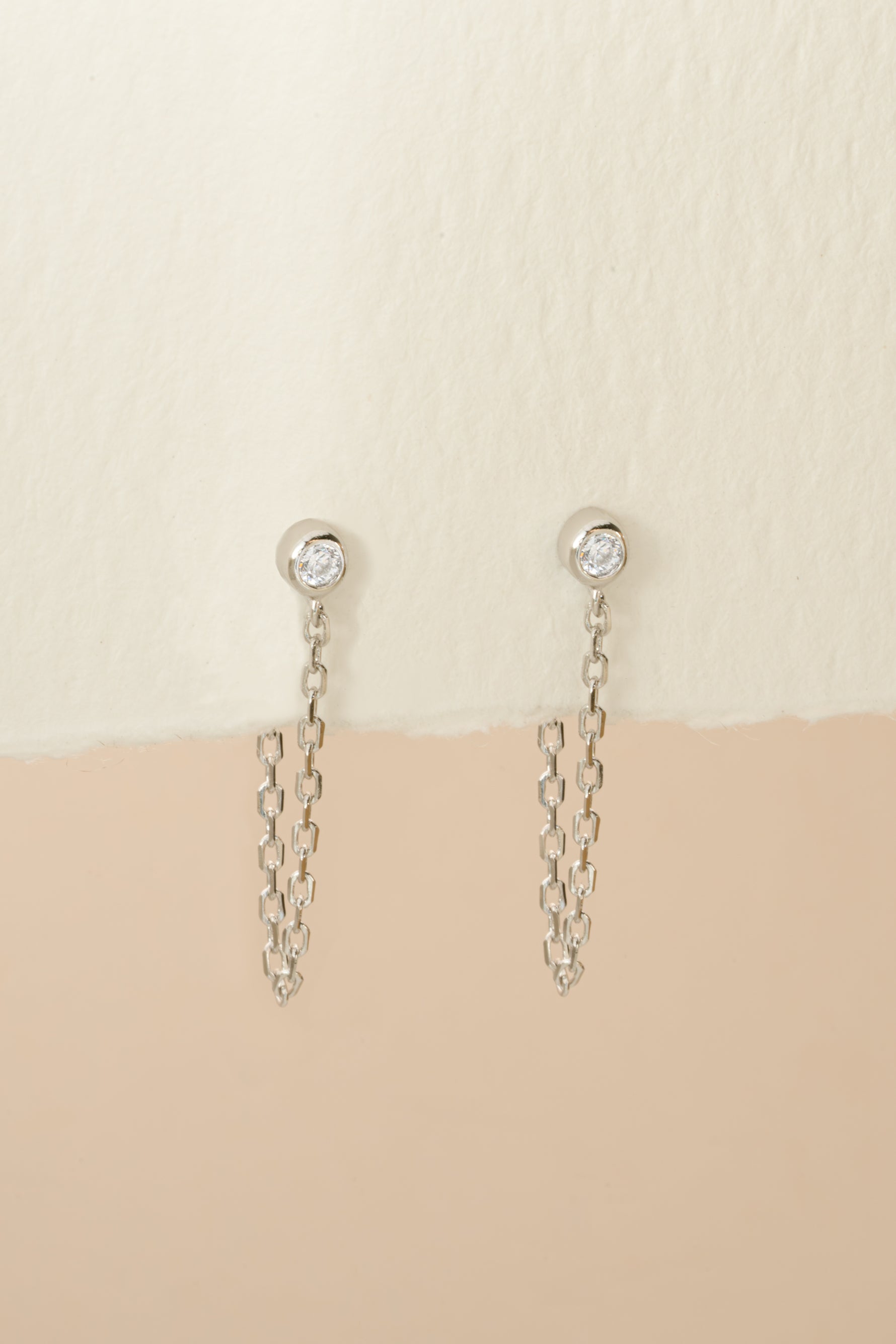 Sterling silver chain stud earrings by Sami Jewels, front view showing delicate chain design and stud backing.