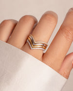 Gold and sterling silver Chevron ring set by Sami Jewels featuring geometric V-shaped designs on multiple rings.