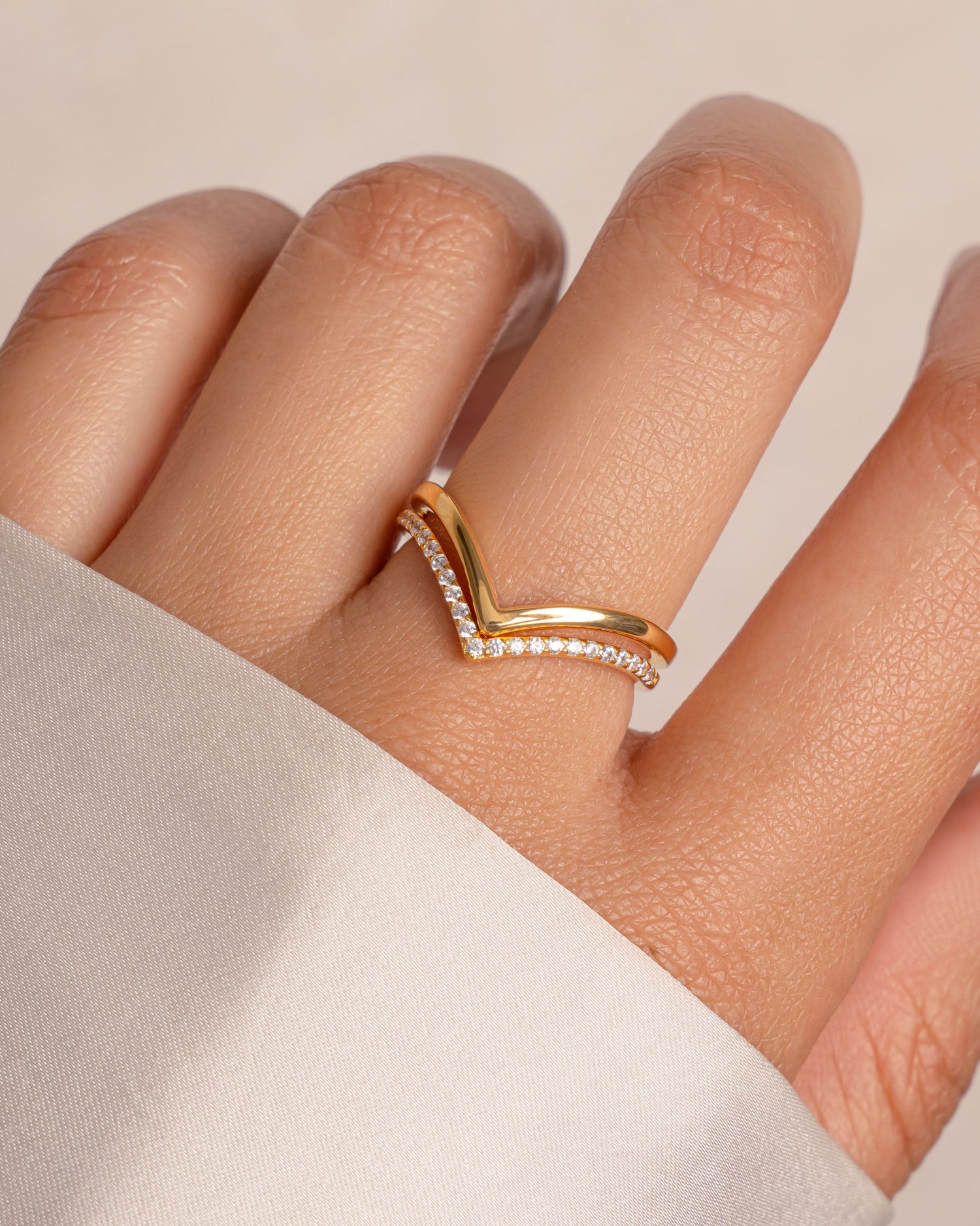 Gold Chevron Ring Set by Sami Jewels featuring multiple stacked rings with geometric chevron designs.