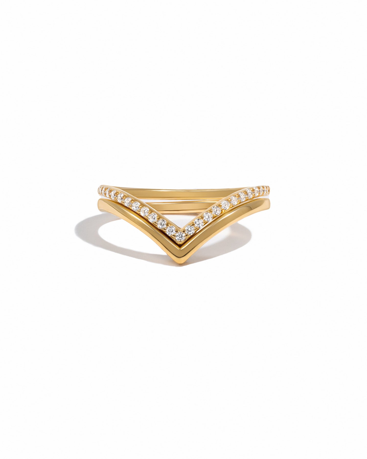 Gold Chevron Ring Set by Sami Jewels featuring multiple stackable rings with chevron designs on a white background.