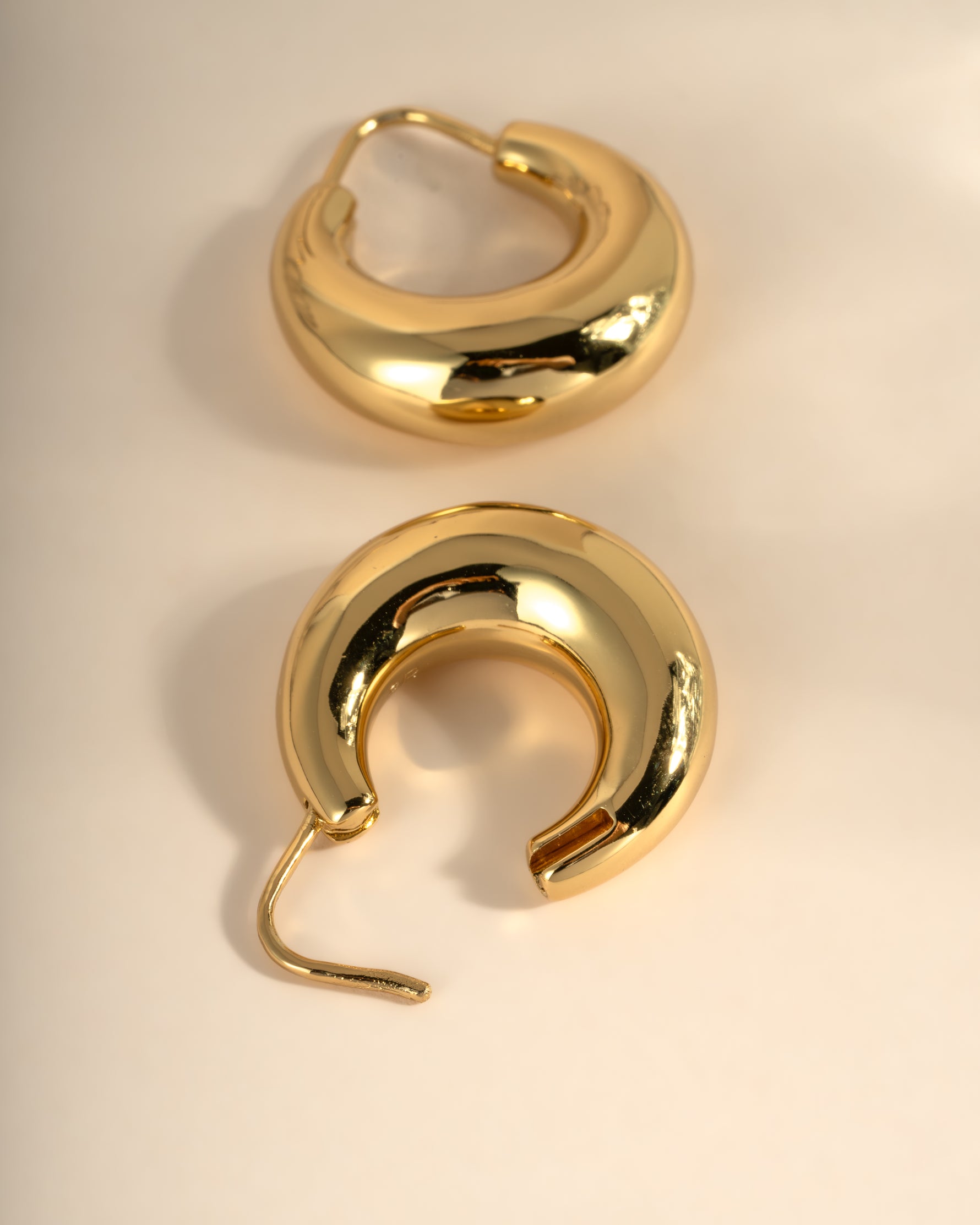 Close-up of gold chunky basket hoop earrings from Sami Jewels, showcasing their bold, textured design.