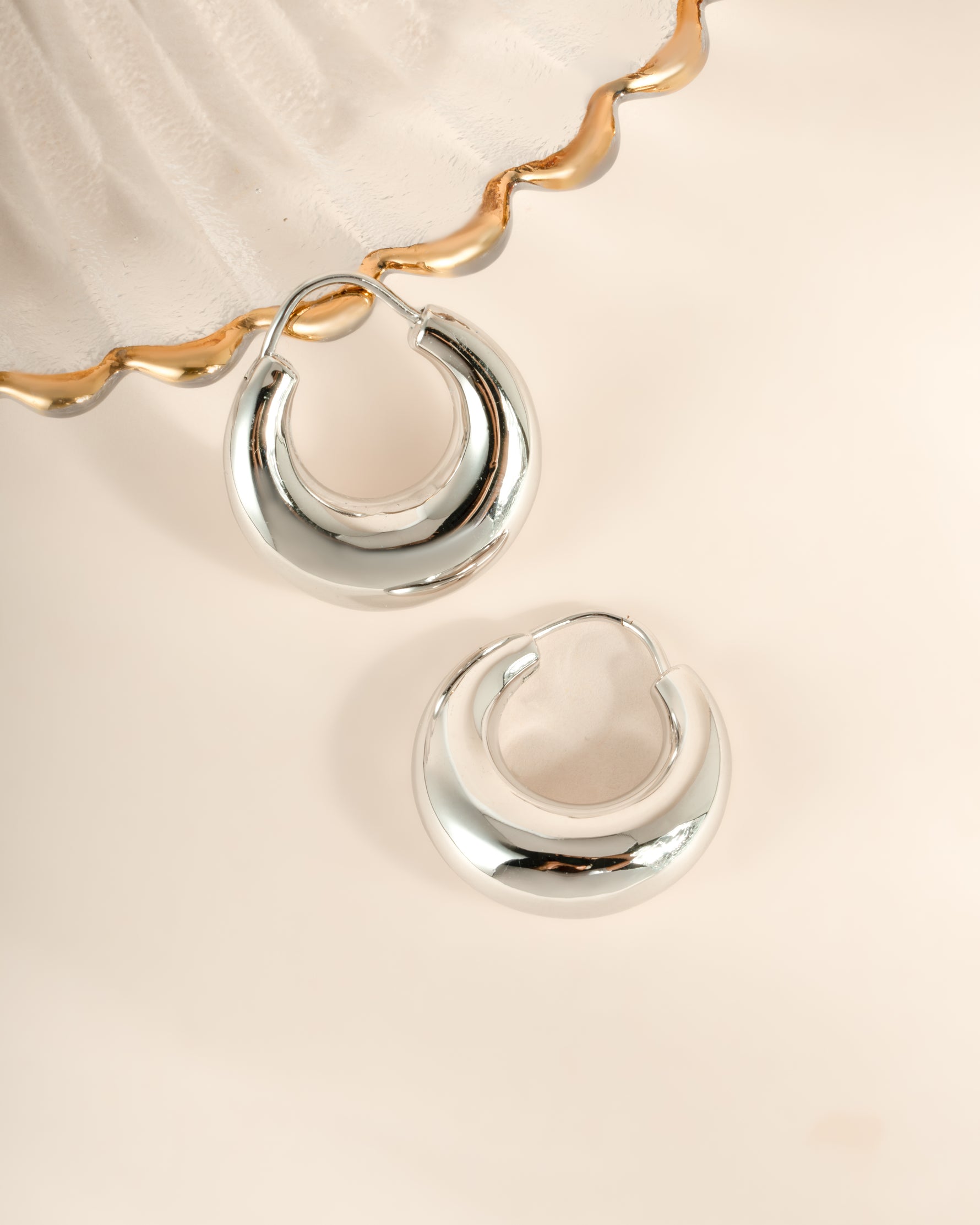 Sterling silver chunky basket hoop earrings by Sami Jewels, featuring bold, textured design with post back closure.
