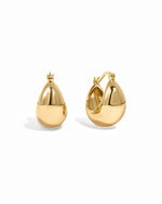 Gold Chunky Basket Tube Hoop Earrings by Sami Jewels displayed on a white background.