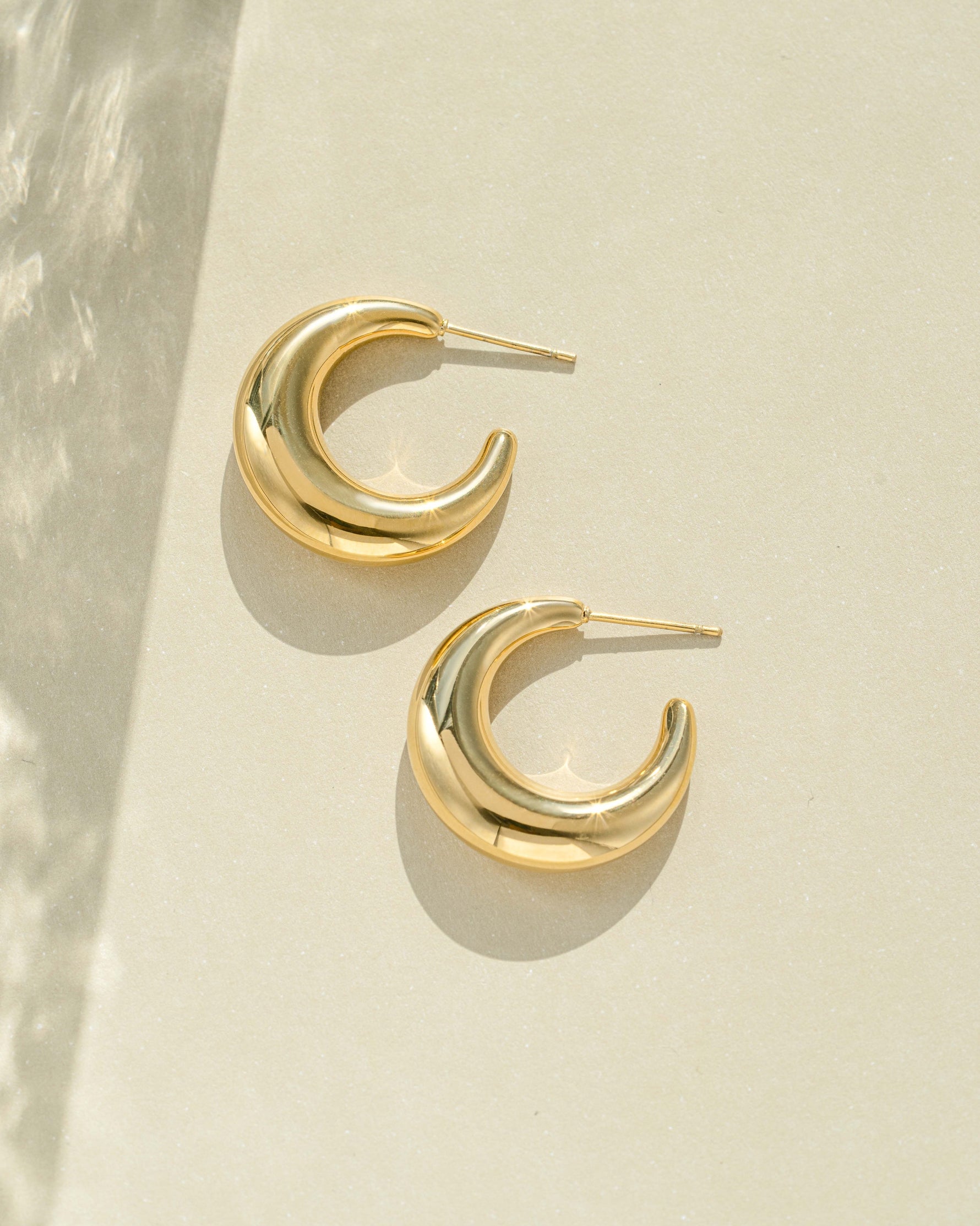 Gold stainless steel SS Gradient Hoops earrings by Sami Jewels, featuring chunky crescent design, close-up view.