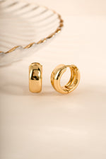 Gold Chunky Olivia Hoops earrings by Sami Jewels, featuring bold, thick huggie hoop design perfect for stylish accessories.