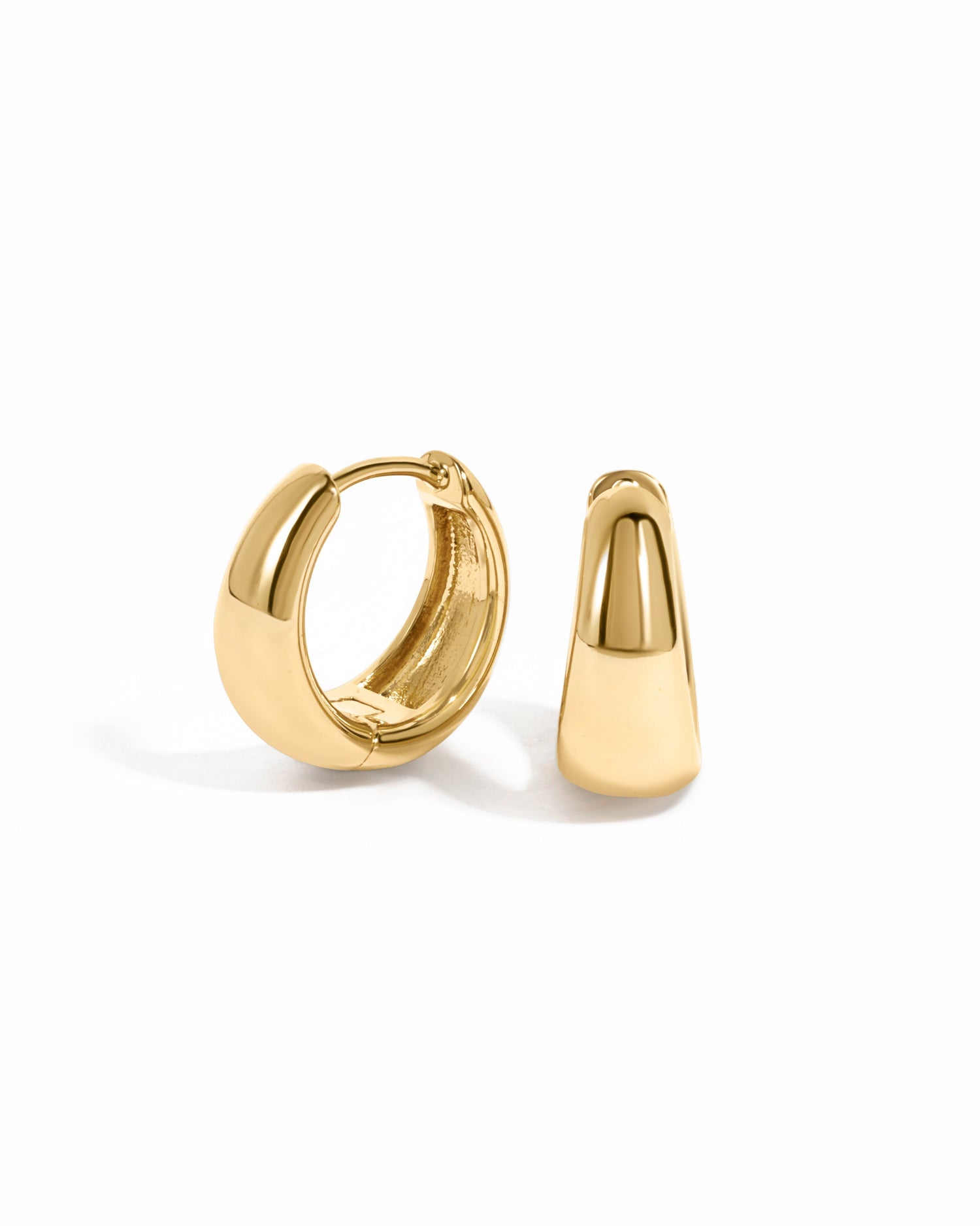 Gold 15mm chunky huggie hoops earrings by Sami Jewels, close-up view showing their bold, rounded design on a white background.