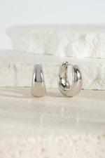 Silver 15mm chunky huggie hoops earrings by Sami Jewels showcasing bold, thick hoop design on a clean background.