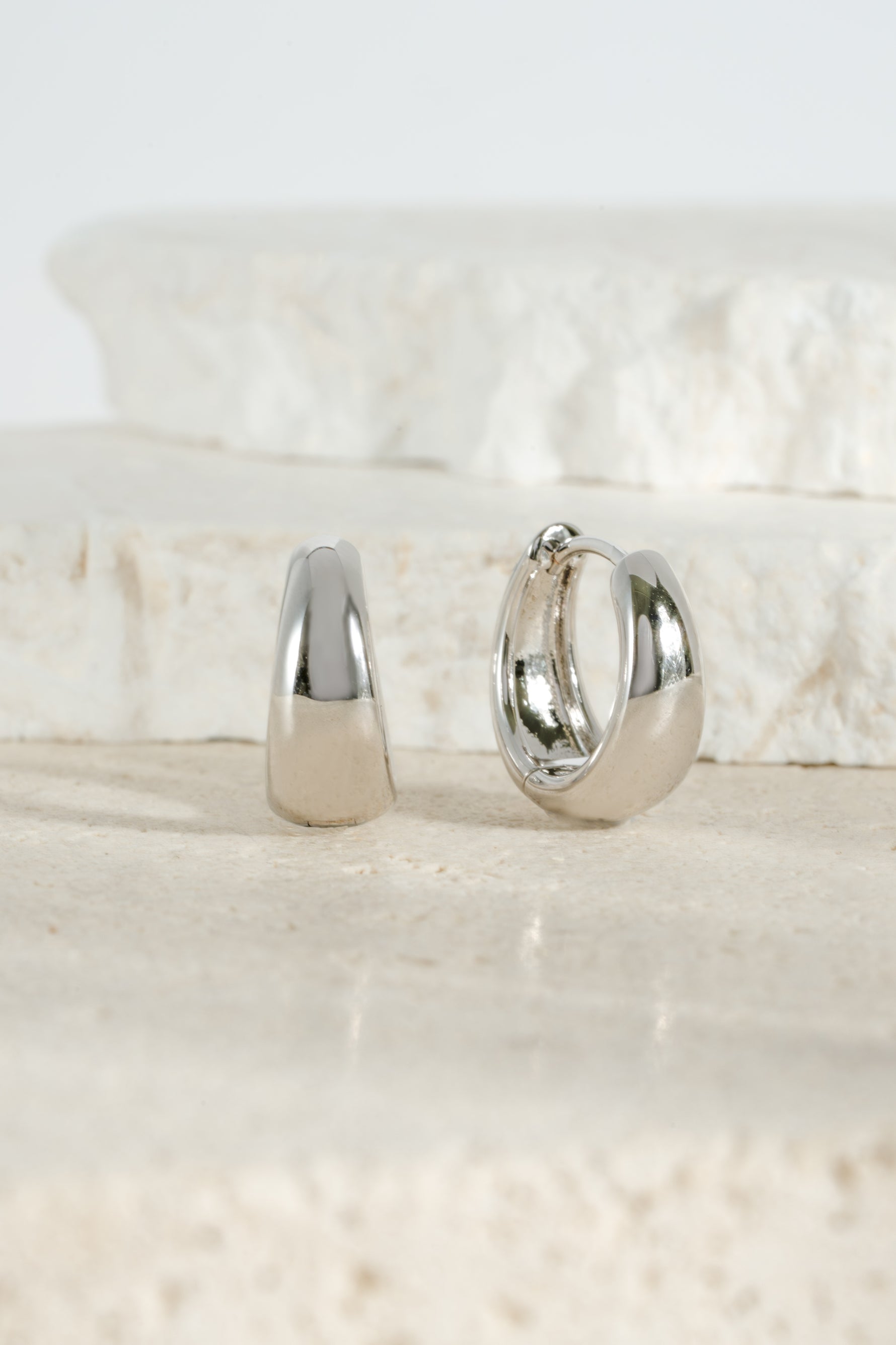 Silver 15mm chunky huggie hoops earrings by Sami Jewels showcasing bold, thick hoop design on a clean background.