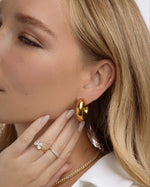 Close-up of gold stainless steel SS Tube Hoops earrings by Sami Jewels, showcasing chunky open hoop design.