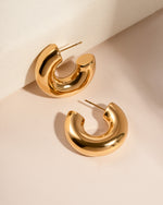 Sami Jewels SS Tube Hoops earrings in gold stainless steel with a chunky open design, close-up view.