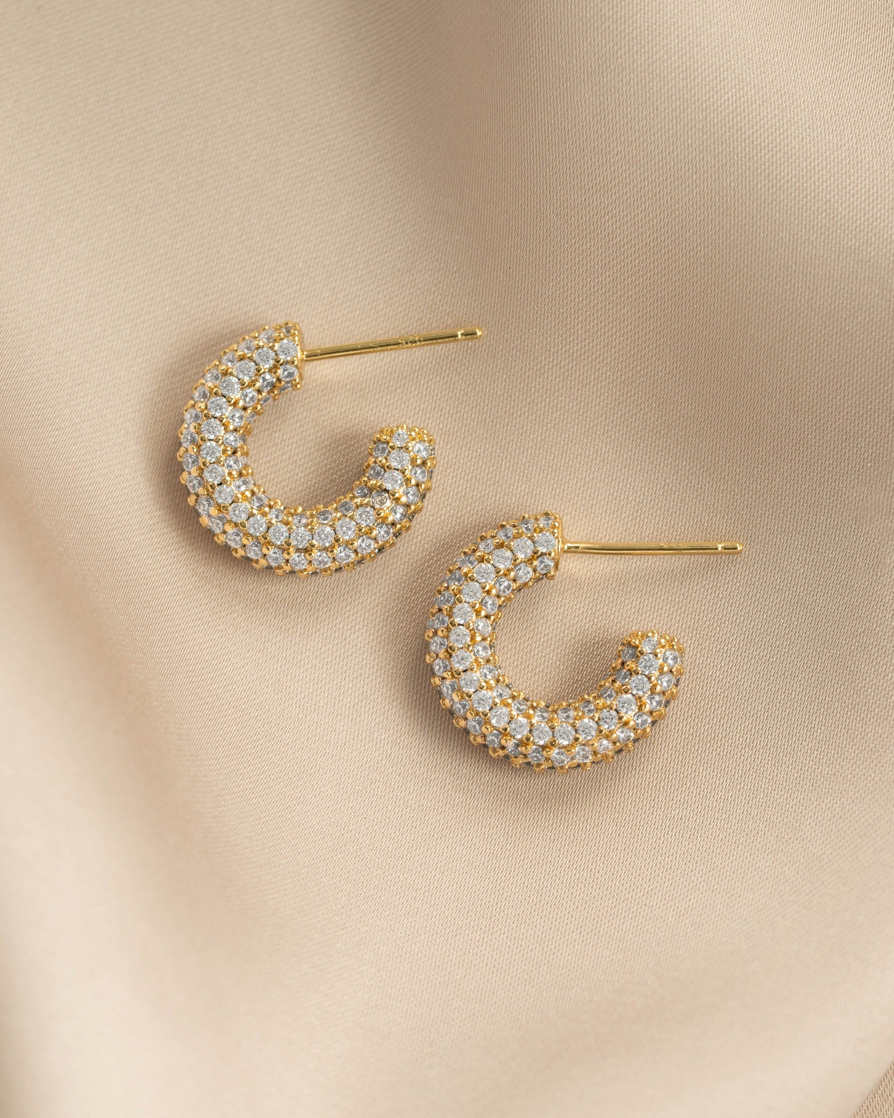 Gold chunky pavé hoop earrings by Sami Jewels, showing a close-up profile view with sparkling pavé detailing.