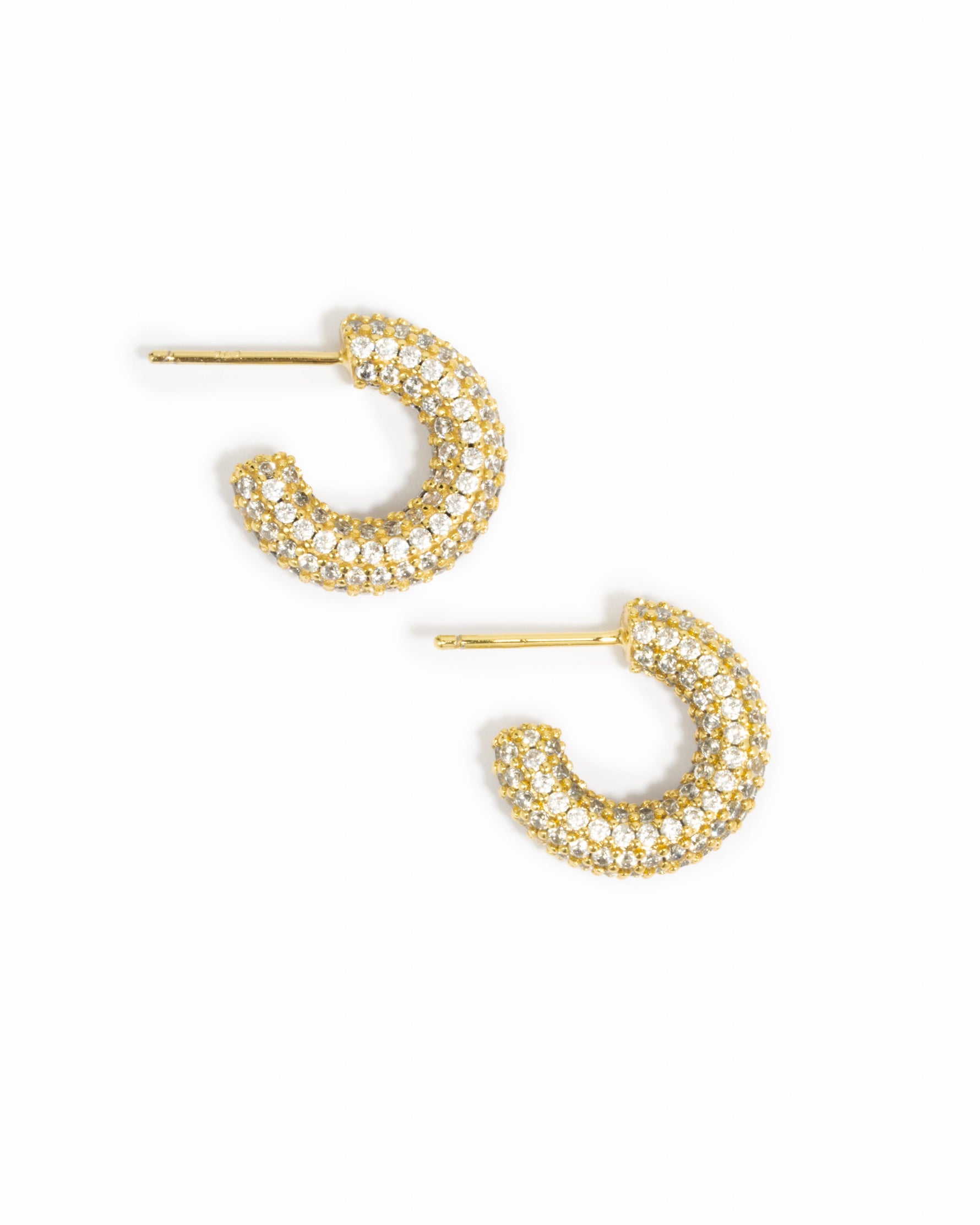 Gold chunky pave hoop earrings by Sami Jewels with a shiny finish, displayed on a white background.