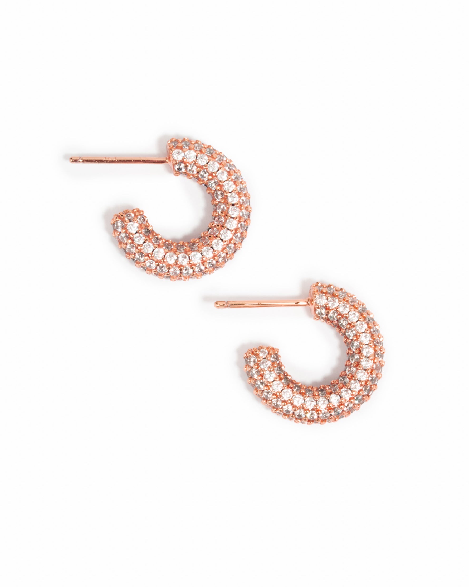 Rose gold chunky pavé hoop earrings from Sami Jewels with sparkling stone accents, displayed on a white background.