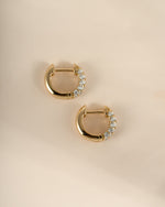 Gold Chunky Pavé Huggie Earrings from Sami Jewels, side profile showing bold, sparkling pave design on small hoop earrings.
