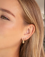 Gold chunky triangle hoop earrings from Sami Jewels with bold geometric design, suitable for stylish accessories.