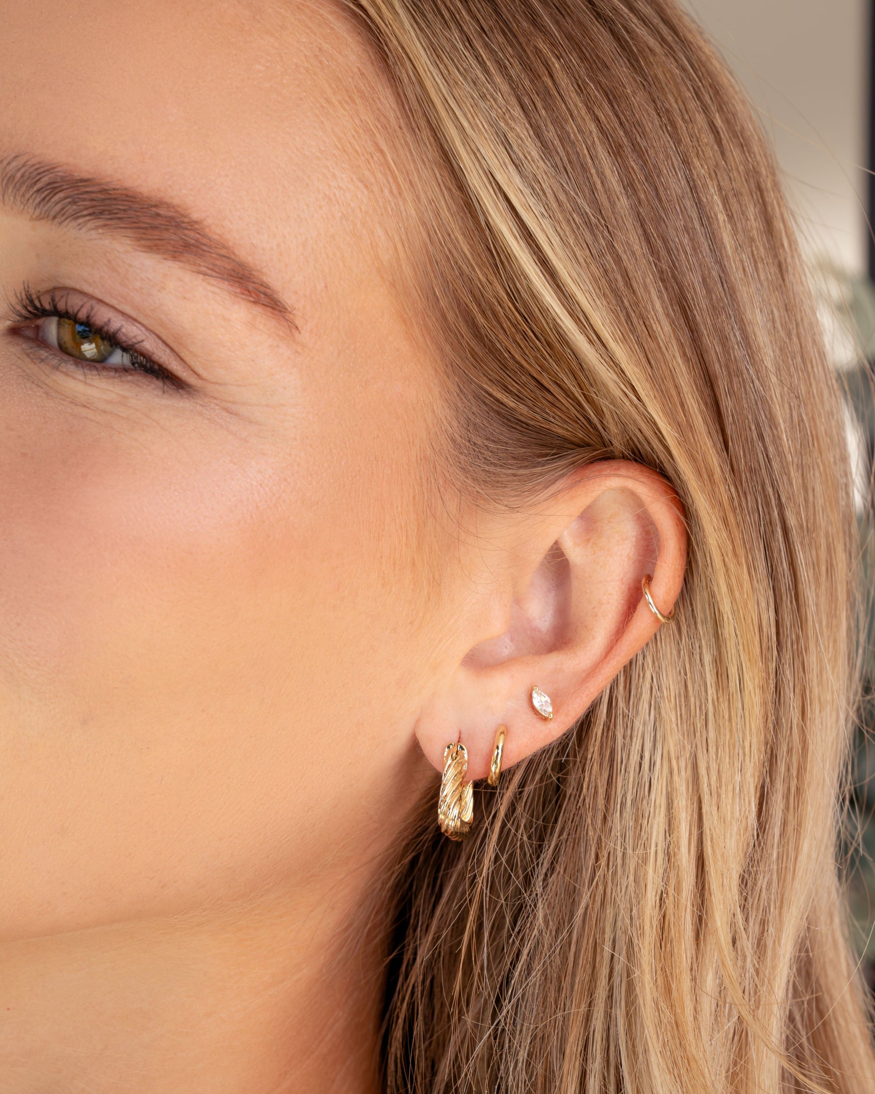 Gold chunky triangle hoop earrings from Sami Jewels with bold geometric design, suitable for stylish accessories.