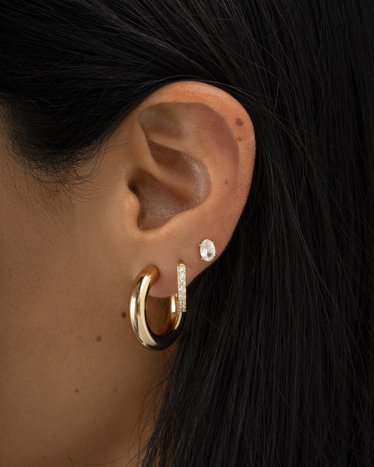 chunky tube hoop earrings in 24mm on models ear