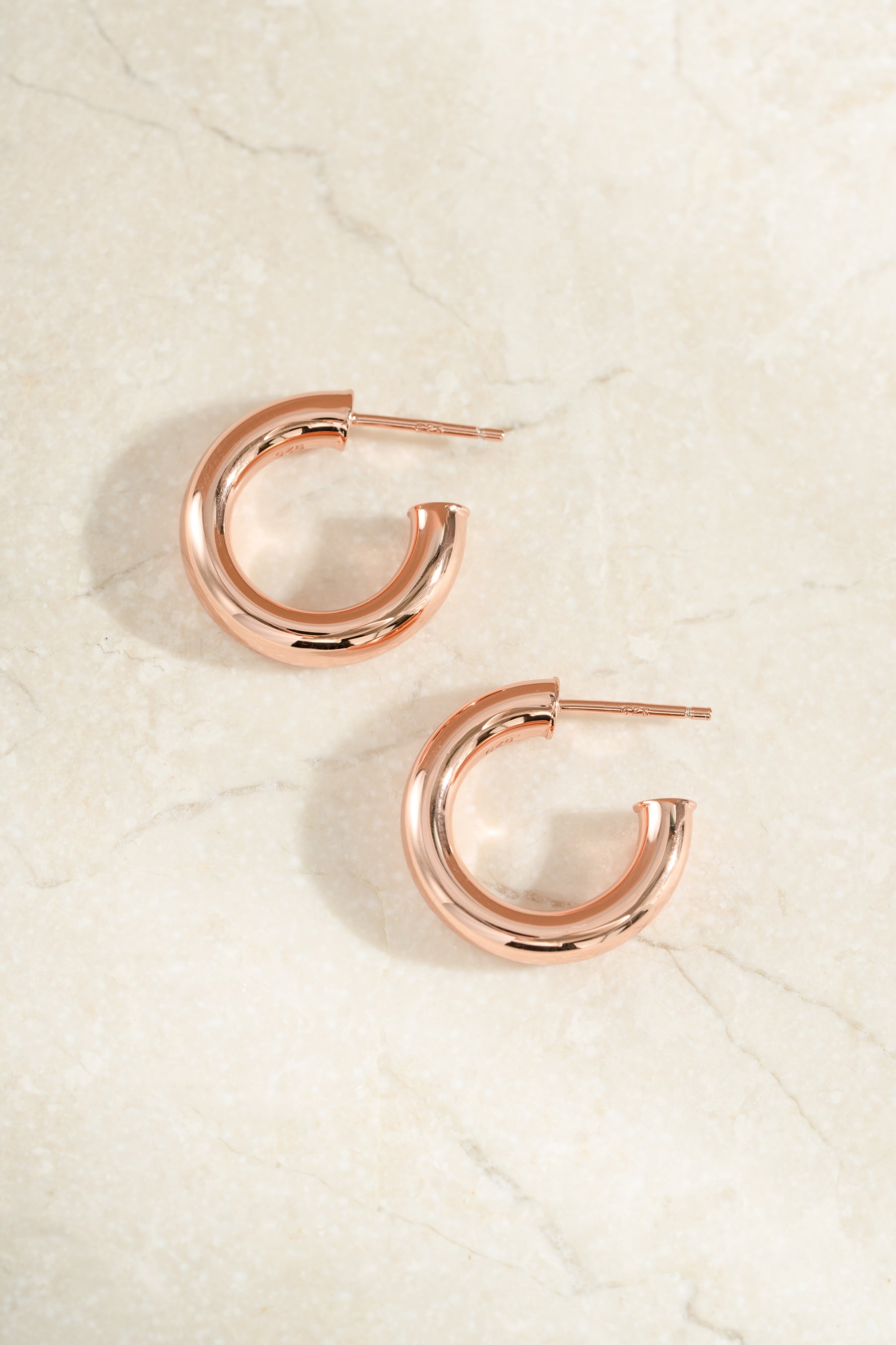 chunky tube hoop earrings in 24mm in rose gold side view