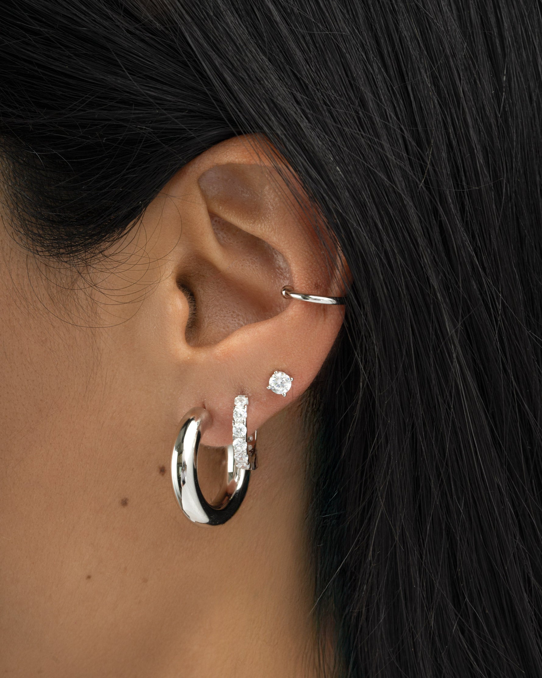 chunky tube hoop earrings in 24mm in sterling silver on womens ear 
