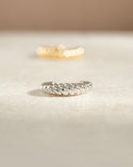 Close-up of Samijewels-527 sterling silver croissant ear cuff earring showcasing its unique, textured design.