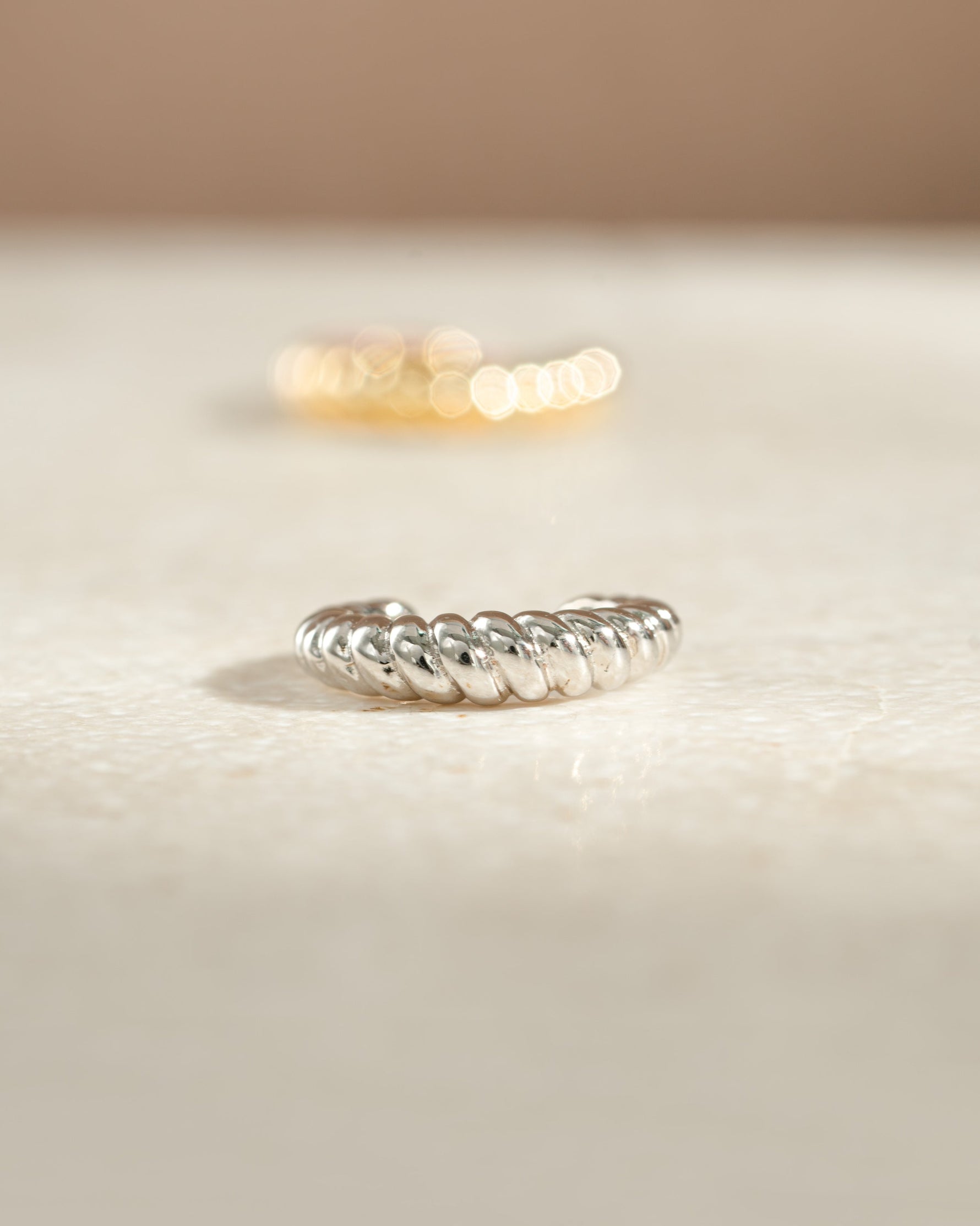 Close-up of Samijewels-527 sterling silver croissant ear cuff earring showcasing its unique, textured design.