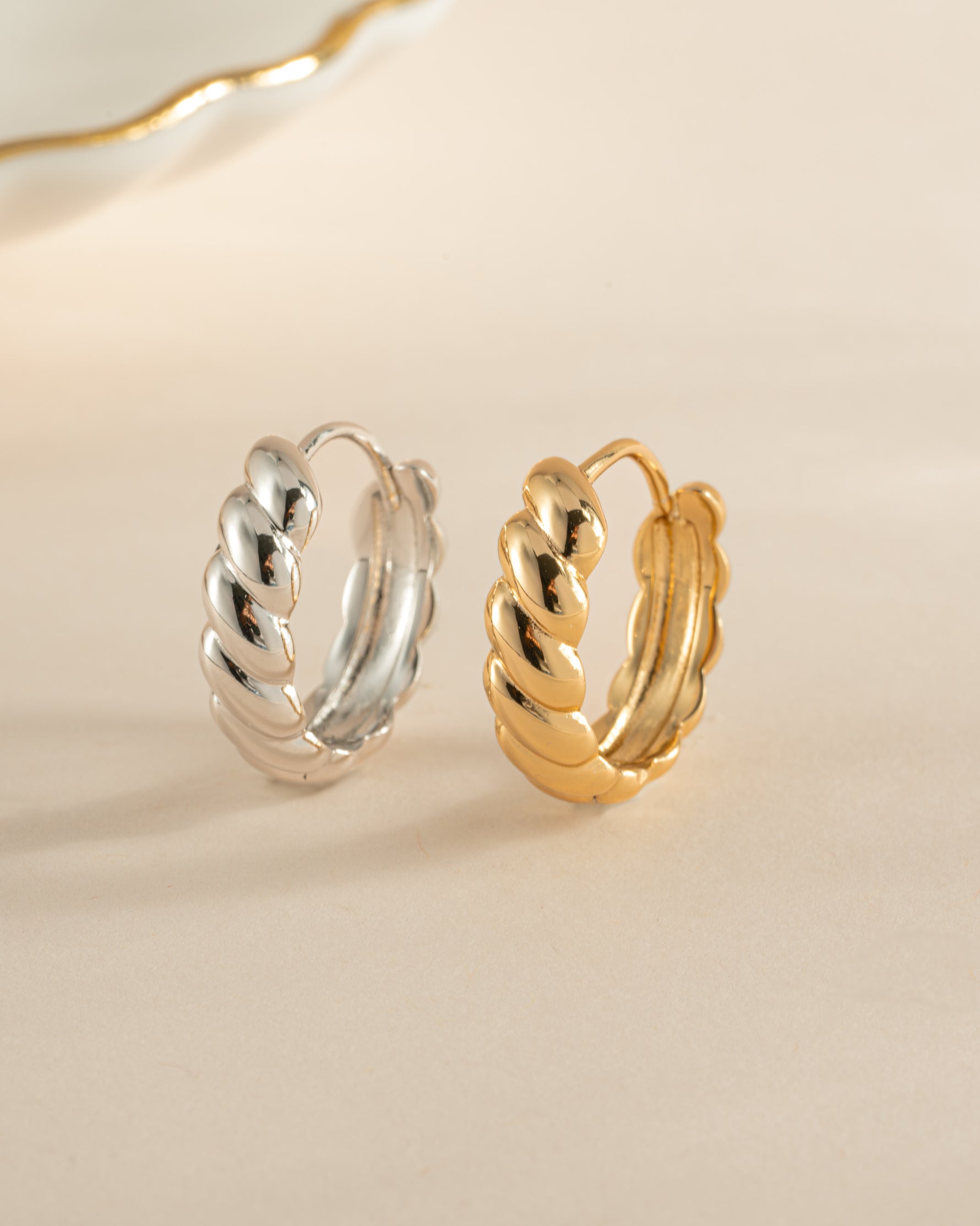 Gold and sterling silver Jacky hoop earrings by Sami Jewels featuring croissant-shaped hoops for a stylish look.