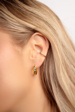 Gold Jacky Hoop Earrings by Sami Jewels featuring croissant-shaped hoop design on a model.
